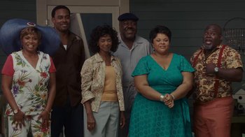 Movie still from “Meet the Browns” (2008), directed by Tyler Perry – A group of people standing next to each other in front of a house; Wide shot, Low angle