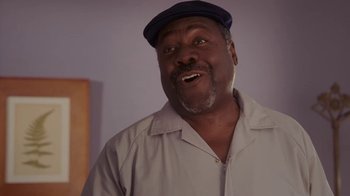 Movie still from “Meet the Browns” (2008), directed by Tyler Perry – A person wearing a hat; Medium shot, Low angle