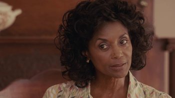 Movie still from “Meet the Browns” (2008), directed by Tyler Perry – An older woman is looking at the camera; Close Up shot, Over the shoulder angle