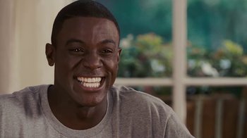 Movie still from “Meet the Browns” (2008), directed by Tyler Perry – A person with a smile on their face; Close Up shot, High angle