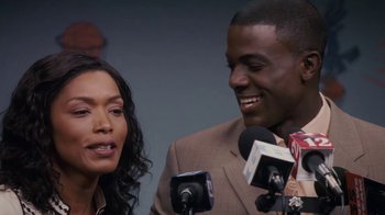 Movie still from “Meet the Browns” (2008), directed by Tyler Perry – A man and a woman are talking to reporters; Close Up shot, Over the shoulder angle