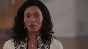 Movie still from “Meet the Browns” (2008), directed by Tyler Perry – A person with long black curly hair; Close Up shot, Over the shoulder angle