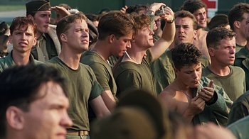 Movie still from “Memphis Belle” (1990), directed by Michael Caton-Jones – A group of young men standing next to each other; Medium shot, High angle
