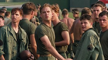 Movie still from “Memphis Belle” (1990), directed by Michael Caton-Jones – A group of young men standing next to each other; Medium shot, Low angle