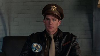 Movie still from “Memphis Belle” (1990), directed by Michael Caton-Jones – A man wearing a uniform and a hat with an eagle on it; Close Up shot, Low angle