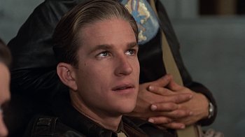 Movie still from “Memphis Belle” (1990), directed by Michael Caton-Jones – A person wearing a leather jacket; Close Up shot, Over the shoulder angle