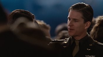 Movie still from “Memphis Belle” (1990), directed by Michael Caton-Jones – A person wearing a military uniform; Close Up shot, Over the shoulder angle