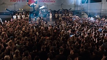 Movie still from “Memphis Belle” (1990), directed by Michael Caton-Jones – A crowd of people sitting in front of an audience; Extreme Wide shot, High angle