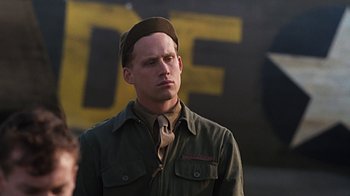 Movie still from “Memphis Belle” (1990), directed by Michael Caton-Jones – A man wearing a hat and a uniform; Close Up shot, Low angle