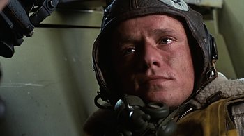 Movie still from “Memphis Belle” (1990), directed by Michael Caton-Jones – A person wearing a helmet; Close Up shot, Low angle