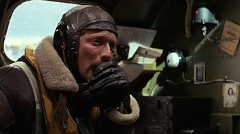 Movie still from “Memphis Belle” (1990), directed by Michael Caton-Jones – A man in a leather jacket and a leather hat; Close Up shot, Low angle