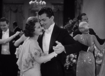 Movie still from “Merrily We Go to Hell” (1932), directed by Dorothy Arzner – A man and a woman are dancing in formal wear; Medium shot, Low angle