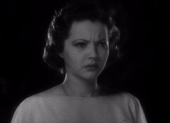 Movie still from “Merrily We Go to Hell” (1932), directed by Dorothy Arzner – An old black and white photo of a woman; Close Up shot, Low angle