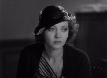 Movie still from “Merrily We Go to Hell” (1932), directed by Dorothy Arzner – A woman in a hat and a black jacket; Close Up shot, High angle