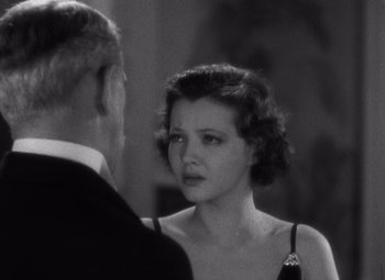 Movie still from “Merrily We Go to Hell” (1932), directed by Dorothy Arzner – An old photo of a man and a woman talking; Close Up shot, Low angle