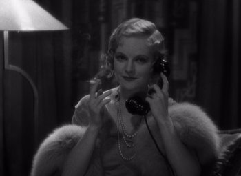 Movie still from “Merrily We Go to Hell” (1932), directed by Dorothy Arzner – An old photo of a woman talking on a phone; Close Up shot, High angle