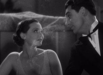 Movie still from “Merrily We Go to Hell” (1932), directed by Dorothy Arzner – A man and a woman looking at one another; Close Up shot, High angle