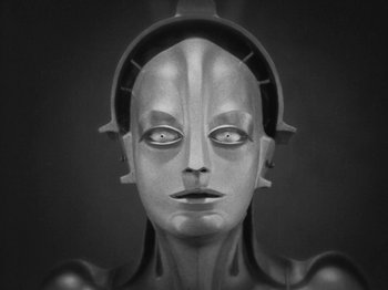 Movie still from “Metropolis” (1927), directed by Fritz Lang – A black and white photo of a robot face; Close Up shot, High angle
