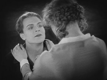 Movie still from “Metropolis” (1927), directed by Fritz Lang – A man and a woman looking into each others eyes; Close Up shot, Over the shoulder angle
