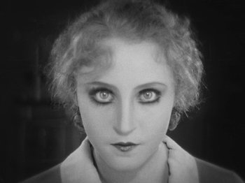 Movie still from “Metropolis” (1927), directed by Fritz Lang – A black and white photo of a woman's face; Close Up shot, High angle