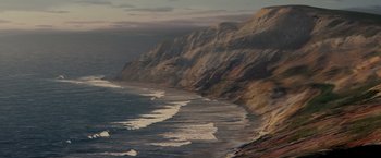 Movie still from “Michael Clayton” (2007), directed by Tony Gilroy – A view of the ocean from a cliff side; Extreme Wide shot, High angle