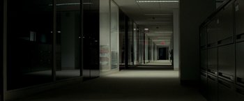 Movie still from “Michael Clayton” (2007), directed by Tony Gilroy – An empty hallway in an office building at night; Extreme Wide shot, High angle