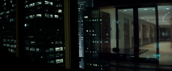 Movie still from “Michael Clayton” (2007), directed by Tony Gilroy – A view of a city at night through a window; Wide shot, Over the shoulder angle