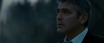 Movie still from “Michael Clayton” (2007), directed by Tony Gilroy – A man's face in the dark; Close Up shot, Low angle