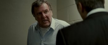 Movie still from “Michael Clayton” (2007), directed by Tony Gilroy – An older man is looking at himself in the mirror; Close Up shot, Over the shoulder angle