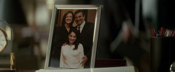 Movie still from “Michael Clayton” (2007), directed by Tony Gilroy – A picture frame with a picture of a woman and a man and a girl; Extreme Close Up shot, Overhead angle