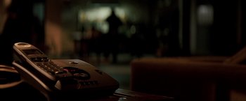 Movie still from “Michael Clayton” (2007), directed by Tony Gilroy – A remote control on top of a table; Extreme Close Up shot, High angle