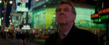 Movie still from “Michael Clayton” (2007), directed by Tony Gilroy – A person wearing a suit and tie; Close Up shot, Low angle