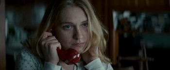 Movie still from “Michael Clayton” (2007), directed by Tony Gilroy – A woman holding a phone up to her ear; Close Up shot, Low angle