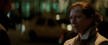 Movie still from “Michael Clayton” (2007), directed by Tony Gilroy – A woman is standing in front of a car; Close Up shot, Over the shoulder angle