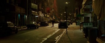 Movie still from “Michael Clayton” (2007), directed by Tony Gilroy – A person walking down a street at night; Extreme Wide shot, High angle