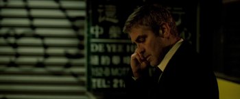 Movie still from “Michael Clayton” (2007), directed by Tony Gilroy – A person talking on a cell phone; Close Up shot, Low angle