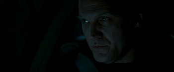 Movie still from “Michael Clayton” (2007), directed by Tony Gilroy – A person in a car at night; Close Up shot, Low angle