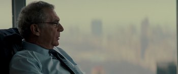 Movie still from “Michael Clayton” (2007), directed by Tony Gilroy – An older man wearing glasses and a neck tie; Close Up shot, Over the shoulder angle