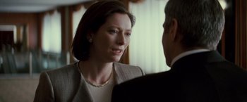 Movie still from “Michael Clayton” (2007), directed by Tony Gilroy – A woman talking to a man in a suit; Close Up shot, Over the shoulder angle