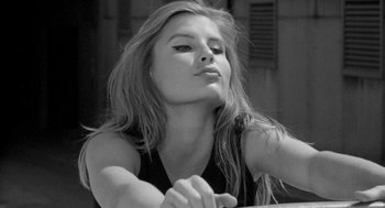 Movie still from “Mickey One” (1965), directed by Arthur Penn – Black and white photograph of a beautiful young woman; Close Up shot, Low angle