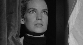 Movie still from “Mickey One” (1965), directed by Arthur Penn – Black and white photograph of a woman looking up; Close Up shot, Low angle