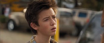 Movie still from “Middle School: The Worst Years of My Life” (2016), directed by Steve Carr – A young man with a mohawk haircut looking to his left; Close Up shot, Over the shoulder angle