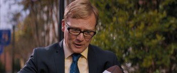 Movie still from “Middle School: The Worst Years of My Life” (2016), directed by Steve Carr – A person wearing a suit and tie; Close Up shot, Over the shoulder angle