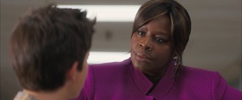 Movie still from “Middle School: The Worst Years of My Life” (2016), directed by Steve Carr – A woman wearing a purple jacket talking to a man; Close Up shot, Over the shoulder angle