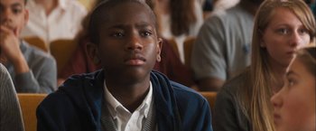 Movie still from “Middle School: The Worst Years of My Life” (2016), directed by Steve Carr – A young man sitting in front of a group of people; Close Up shot, Over the shoulder angle