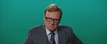 Movie still from “Middle School: The Worst Years of My Life” (2016), directed by Steve Carr – A man in a suit and tie with a frowning look on his face; Close Up shot, Low angle