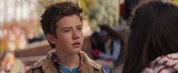 Movie still from “Middle School: The Worst Years of My Life” (2016), directed by Steve Carr – A young man is looking into the distance; Close Up shot, Over the shoulder angle