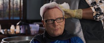 Movie still from “Middle School: The Worst Years of My Life” (2016), directed by Steve Carr – A man with a bald head and glasses; Close Up shot, Over the shoulder angle