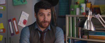 Movie still from “Middle School: The Worst Years of My Life” (2016), directed by Steve Carr – A person wearing a vest and a tie; Close Up shot, Over the shoulder angle