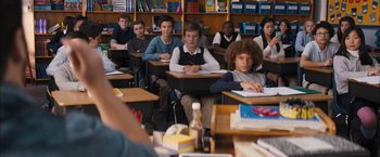 Movie still from “Middle School: The Worst Years of My Life” (2016), directed by Steve Carr – A group of young people sitting at desks in a class room; Medium shot, Over the shoulder angle